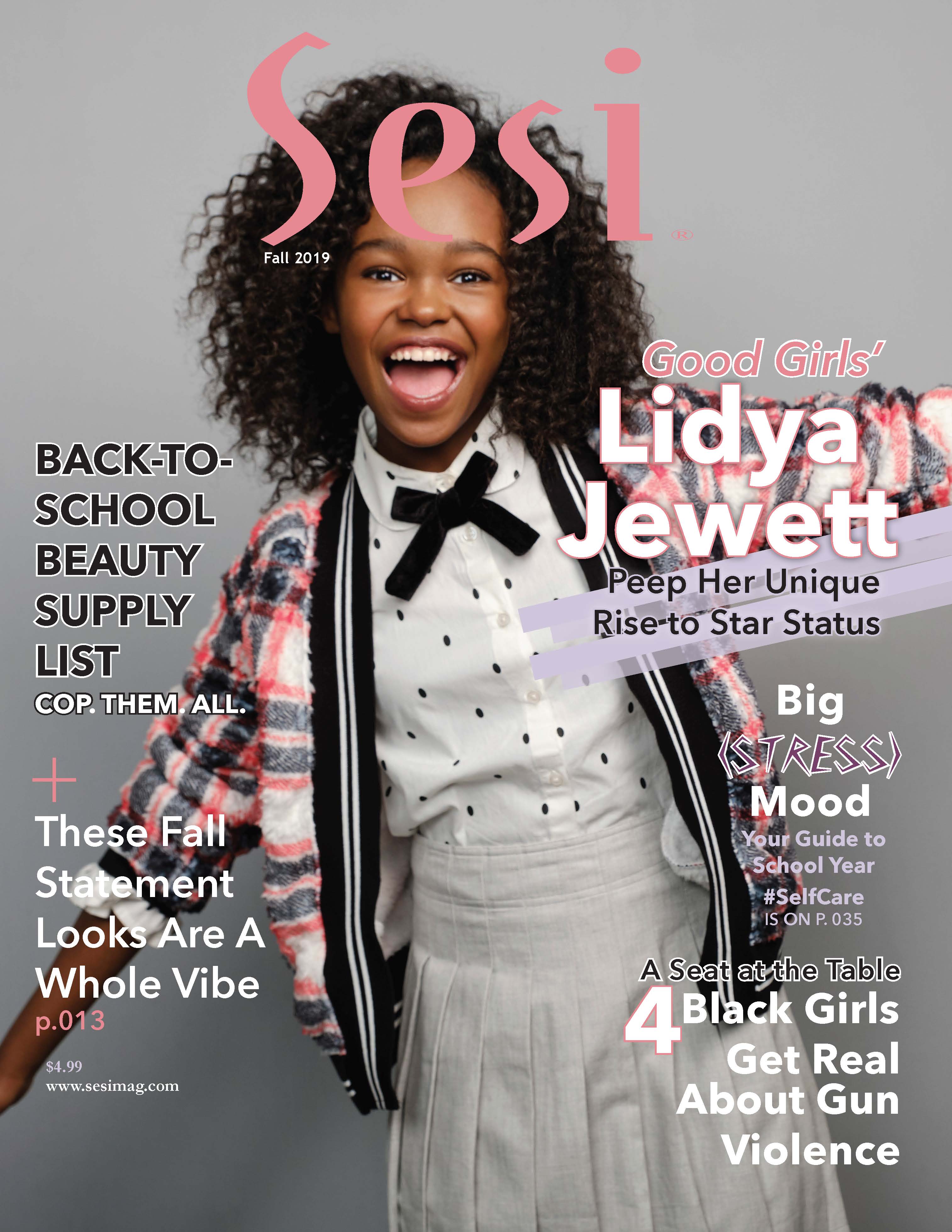 Lidya Jewett on the fall 2019 cover of Sesi magazine, the Black teen magazine. Background color is gray. Lidya is wearing a pink ,black, gray, and white houndstooth jacket over a white top with black polka dots and a mini black bow tie. She's smiling wide, arms oustretched. Her hair is wavy.