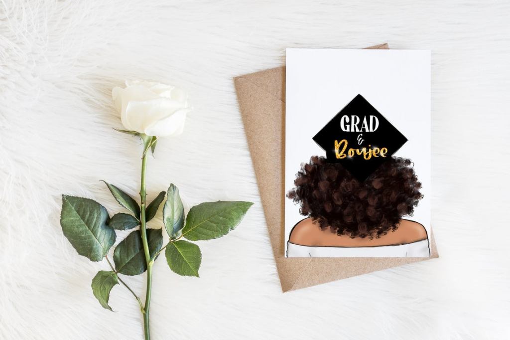 Graduation card with illustration of Black girl from the back -- curly afro wearing a black grad cap that says, "Grad & Boujee."