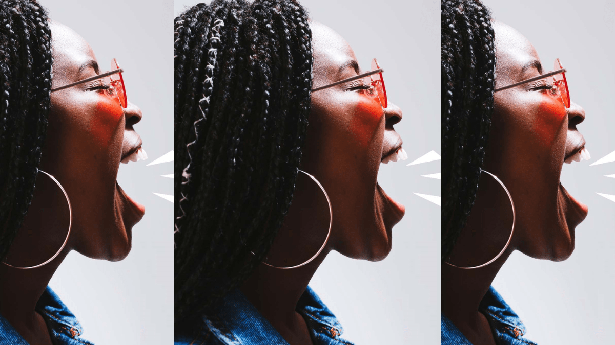 Black teen girl with braids making a face as though she's shouting; illustrates this article about performative activism