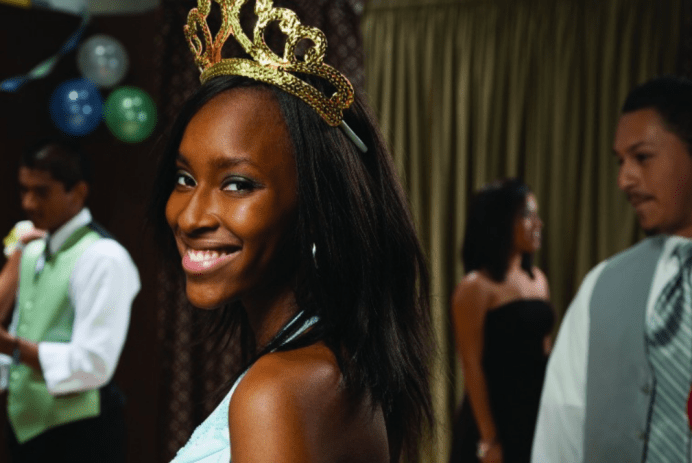 African-American teenaged girl wearing tiara at prom