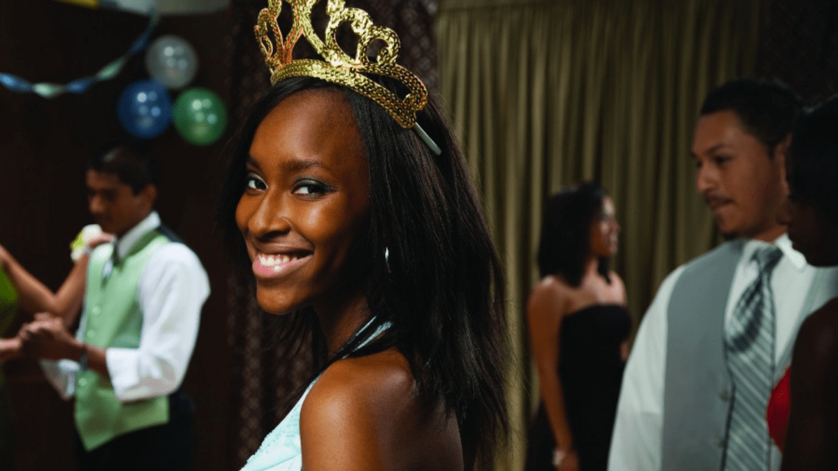 African-American teenaged girl wearing tiara at prom